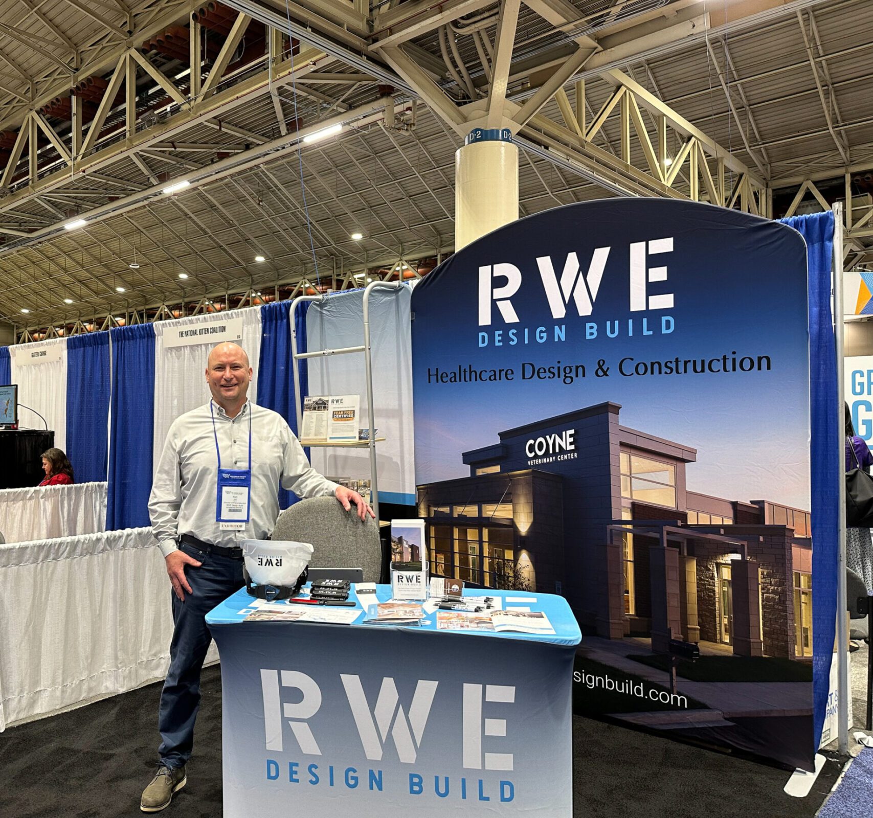 This image showcases an RWE employee working their trade show booth.