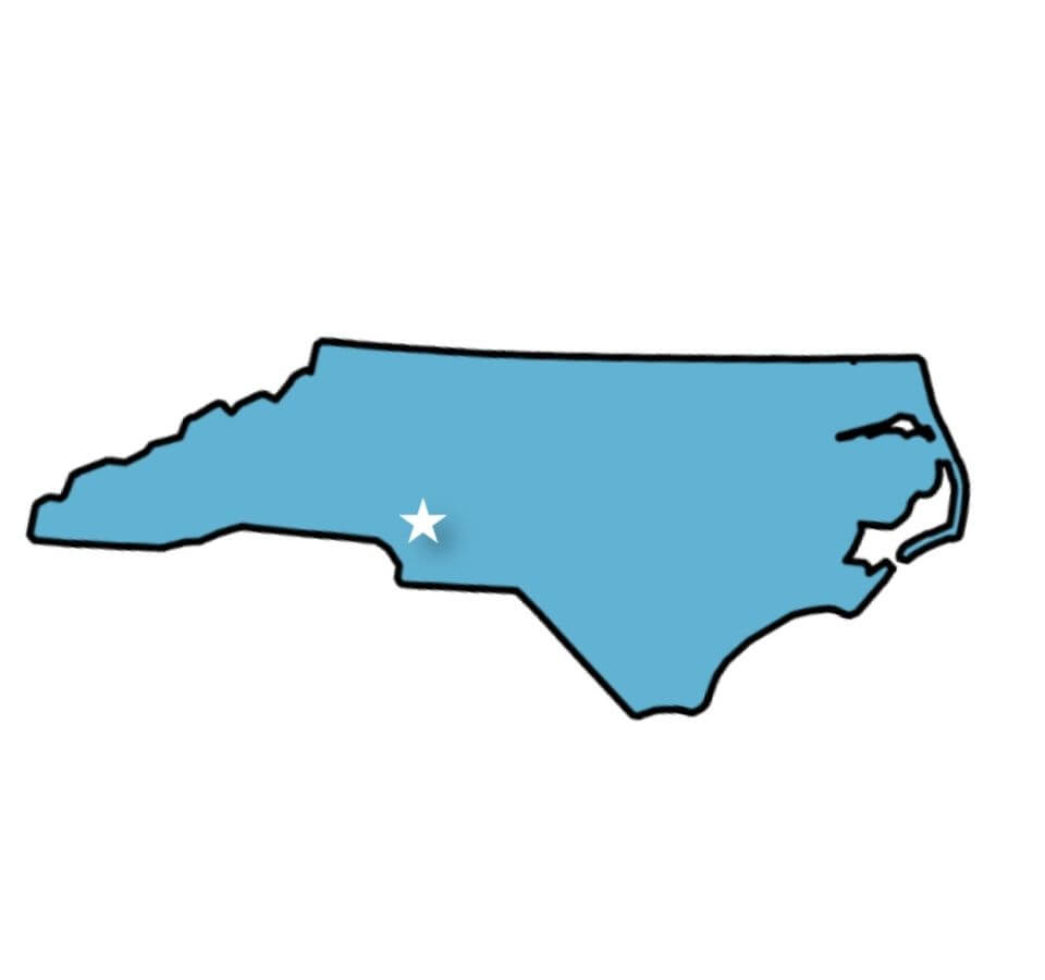 Illustration of the state of North Carolina highlighted in blue with a white star marker.